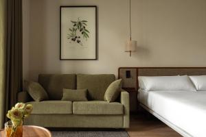 Postel nebo postele na pokoji v ubytování Batimont Suites & Apartments