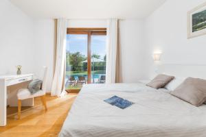 Ένα ή περισσότερα κρεβάτια σε δωμάτιο στο Villa Terra Rossa +44 φωτογραφίες