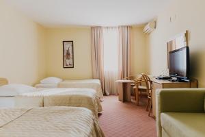 Postel nebo postele na pokoji v ubytování Hotel Silver