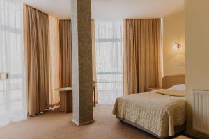 Postel nebo postele na pokoji v ubytování Hotel Silver