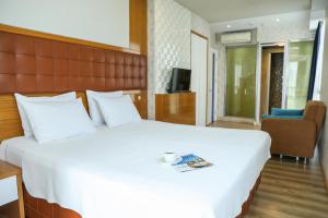 A television and/or entertainment centre at The Hera Platinum Hotel