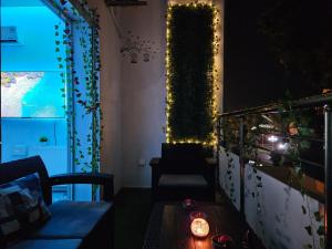 a room with a couch and a window with lights at Luxury Apartment Seaside in Sousse Tourist zone - Internet WIFI in Sousse