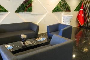 A seating area at The Hera Platinum Hotel