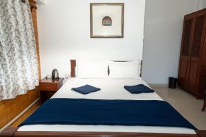 Nasya Beachside Cottages客房内的一张或多张床位