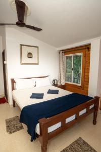 Nasya Beachside Cottages客房内的一张或多张床位