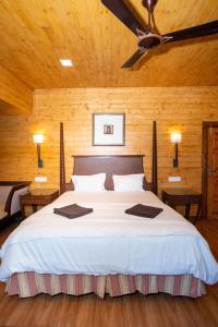 Postel nebo postele na pokoji v ubytování Nasya Beachside Cottages + 37 fotografií