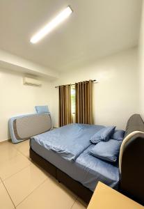 Postel nebo postele na pokoji v ubytování Happy Guest House Nibong Tebal 开心民宿高渊区