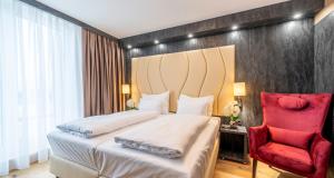 Postel nebo postele na pokoji v ubytování PLAZA Residence Wiener Neustadt