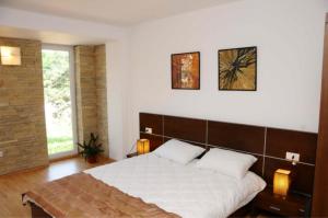 Un pat sau paturi într-o cameră la Vila Cube