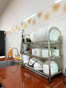 Ένα ή περισσότερα κρεβάτια σε δωμάτιο στο Happy Guest House Nibong Tebal 开心民宿高渊区