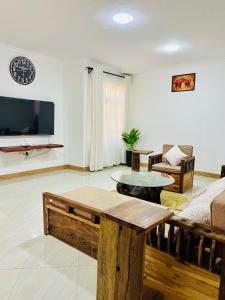 TV a/nebo společenská místnost v ubytování Urban Nest