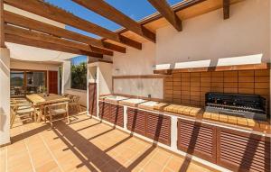 an outdoor kitchen with a table and a stove at Casa Vistamar in S'Estanyol de Migjorn +21 photos