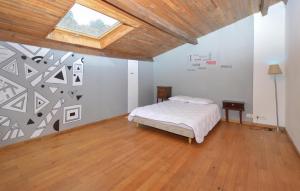 a bedroom with a bed and a skylight at 4 Bedroom Lovely Home In Azilone Ampaza in Azilone-Ampaza +23 photos