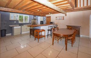 a kitchen and dining room with a table and chairs at 4 Bedroom Lovely Home In Azilone Ampaza in Azilone-Ampaza