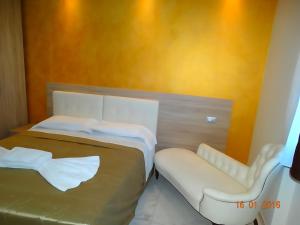 Postel nebo postele na pokoji v ubytování Hotel Moderno