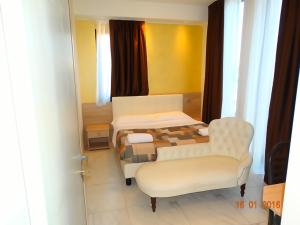 Postel nebo postele na pokoji v ubytování Hotel Moderno