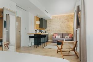 Kuchyň nebo kuchyňský kout v ubytování Aquitania Home Suites
