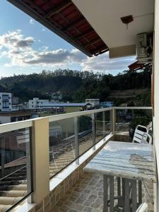 En balkon eller terrasse på CASA 97 completa! Horário Flexível!