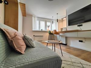 a living room with a couch and a table at Teka’s home in Sarajevo
