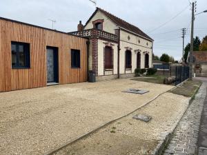 an old house with a dirt road in front of it at Chez Tantine in Troyes