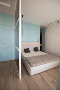 Giường trong phòng chung tại Vila Luarasi