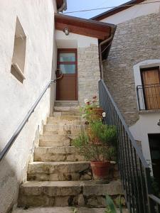 a stairway leading to a door of a house at Avalon in Pietrelcina