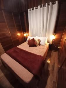 a bedroom with a bed with a white curtain at Cabana Family - Na Mata Atlântica in Juquitiba +45 photos