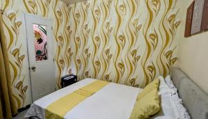 Postel nebo postele na pokoji v ubytování Serdena Homestay Fronting Cuatro Islas