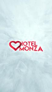 サントスにあるMonza Hotel e Motel Adult Onlyの雪の中の猿の赤い看板