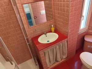 a bathroom with a sink and a shower at Casa Ludovica Centocelle in Rome +46 photos