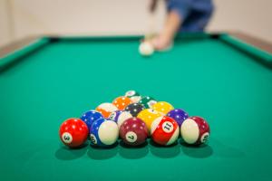 a group of billiard balls on a pool table at Borowy Dwór- Biznes, Spa & Fun in Szaflary