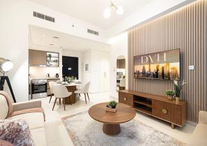 a living room with a couch and a table at Stylish Downtown Retreat, Burj Crown, Opera & Boulevard View in Dubai