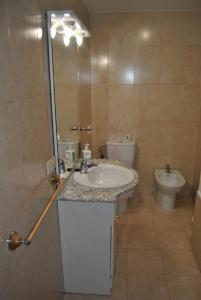 a bathroom with a sink and a toilet at Casa el Alfar mudéjar in Teruel +27 photos