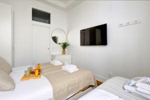 Un ou plusieurs lits dans un hébergement de l'établissement 402 Suite Netter - Superbe Studio à Paris