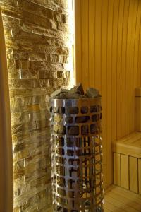 a stack of wine bottles sitting next to a brick wall at Forest Zlatni Bor in Zlatibor