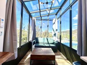 a room with a couch in front of a window at Star Gazer in Orderville