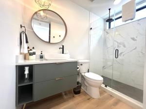 a bathroom with a sink and a toilet and a mirror at Mountain View in Orderville