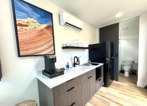 a kitchen with a sink and a refrigerator at Valley View in Orderville
