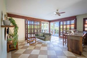 a living room with a couch and a table at The Village at Blue Bay Golf & Beach Resort in Sint Michiel +20 photos