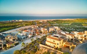 an aerial view of a village next to the ocean at Golfers' Oasis Villa in Cabo San Lucas