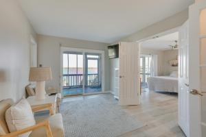 a living room with a bedroom and a bed at Private Hot Tub and Dock North Topsail Beach Home in North Topsail Beach +37 photos