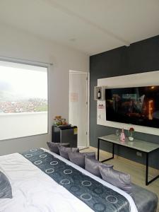 Postel nebo postele na pokoji v ubytování Mirador samsara Penthouse con Jacuzzi al aire libre,piso completo