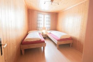 Postel nebo postele na pokoji v ubytování Chalet Aurora