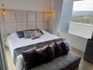 Postel nebo postele na pokoji v ubytování Mirador samsara Penthouse con Jacuzzi al aire libre,piso completo