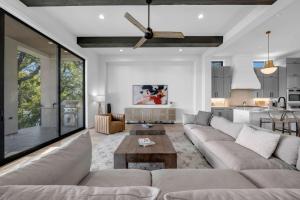 a living room with a couch and a table at Ellen Lake Luxe with Concierge Services in Kingsland +46 photos
