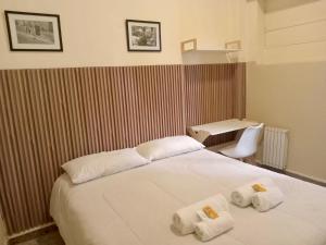 Ένα ή περισσότερα κρεβάτια σε δωμάτιο στο Sabatico Travelers Hostel & Guesthouse