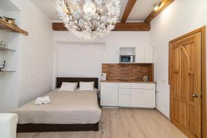 Ένα ή περισσότερα κρεβάτια σε δωμάτιο στο St Anne studio