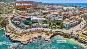 an aerial view of beach house resort and the ocean at Spectacular La Jolla Cove Compound in San Diego