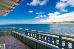 a view of the ocean from the balcony of a house at Spectacular La Jolla Cove Compound in San Diego
