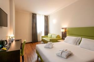 Postel nebo postele na pokoji v ubytování Kona Hotel Verona by Kleos Group Collection